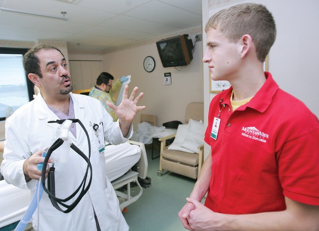 Palo Verde junior Kyle Clark, 16, listens to respiratory therapist Ali Khodabaksh while taking part in the Mountain View Hospital explorer program.