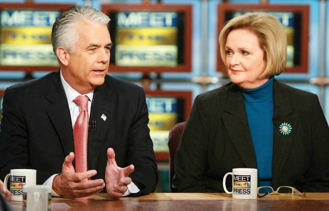 Sen. John Ensign, R-Nev., left, speaks as Sen. Claire McCaskill, D-Mo, listens Sunday on "Meet the Press" at the NBC studios in Washington. Ensign criticized a stimulus plan that would give states money.