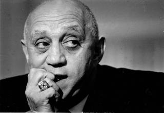 Former UNLV Men's Basketball coach Jerry Tarkanian bites his nails during a press conference. 