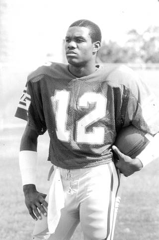 NFL great Randall Cunningham during his days with UNLV. Cunningham threw for over 8,000 passing yards an averaged 45.6 yards per punt for the Rebels, both UNLV records. 