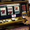 Gene Gabaldon puts a few dollars on a Megabucks machine at the South Point Casino on Friday, Feb. 13, 2009. 