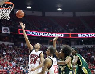 Tre'Von Willis blows past the Colorado State defense Saturday night at the Thomas & Mack Center. The Rebels defeated Colorado State 89-70 for their second straight win.  