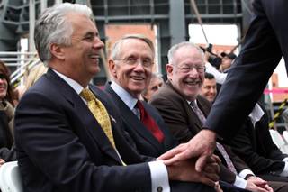 Sen. John Ensign, from left, Sen. Harry Reid and Mayor Oscar Goodman laugh as former Nevada Governor Kenny Guinn passes to take the stage in February to speak at a press conference announcing the Lou Ruvo Brain Institute's partnership with the Cleveland Clinic at the brain institute in Las Vegas.