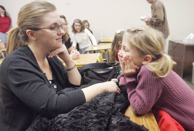 Calvary Chapel's Mary Cullen talks to her daughter, Summer, before she competes in the Association of Christian Schools speech competition on Friday at Mountain View Christian School.
