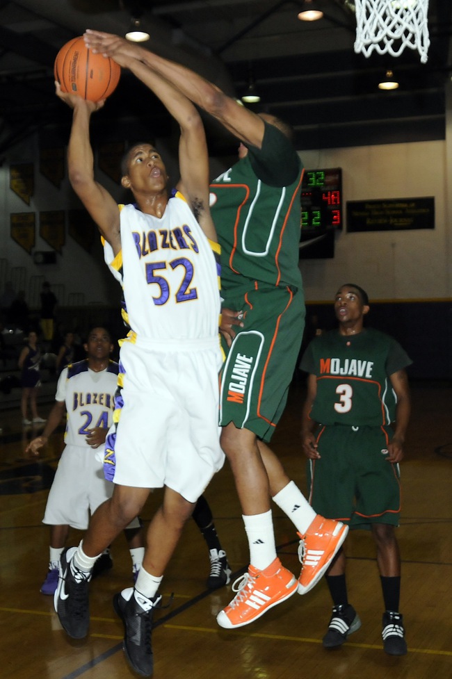 Durango forward Shawn Jones draws a foul against Mojave's Anthony Marshall during the second half of that Sunset Regional quarterfinal at Durango High School Tuesday.
