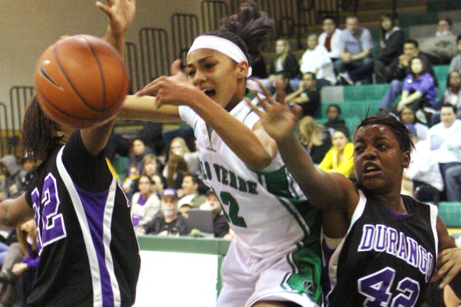 Palo Verde guard Shameka Smith attempts to keep the ball away from Durango forward Kristen Gaines and guard Jasmine Thomas during the Sunset Regional girls basketball quarterfinals at Palo Verde High School on Wednesday.
