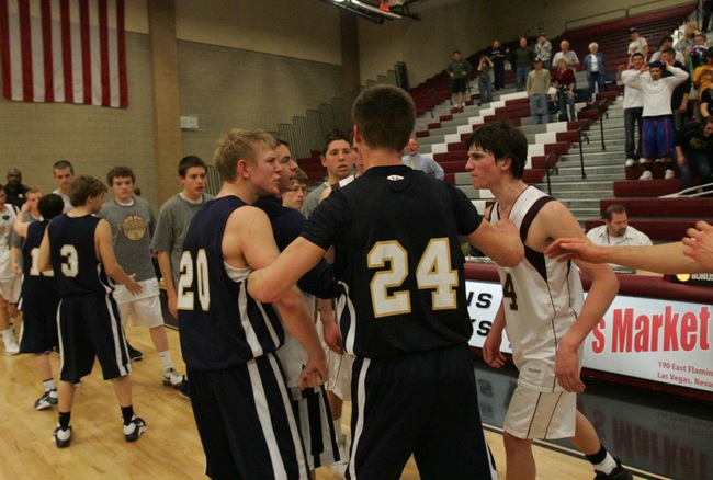 Boulder City's Joey Western (20), left, and Faith Lutheran's Nate McMurran (4), right, argue after their 3A Southern League basketball tournament game at Desert Oasis High Thursday.

