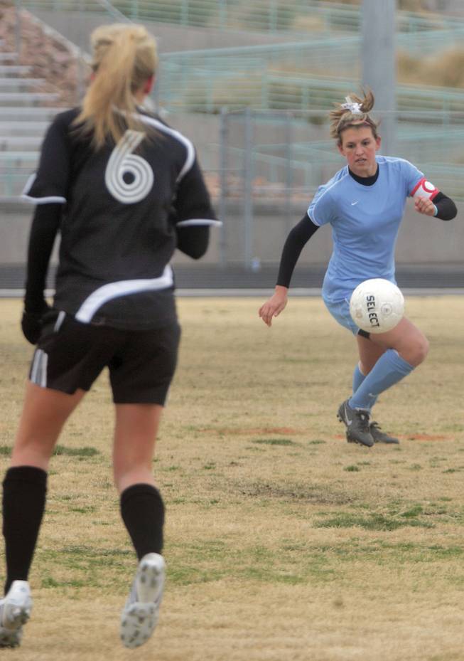 Julie Owens, a midfielder on the Centennial girls' soccer team, runs after the ball during a game against Palo Verde on Feb. 9 at Centennial High School. Owens recently signed a letter of intent to play soccer at UNLV next fall.
