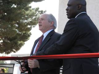 UNLV President David Ashley and Harrah's Entertainment vice president of national diversity relations Tony Gladney cut the ribbon outside the newly dedicated Multicultural Center-Centro Multicultural at UNLV's campus Wednesday.