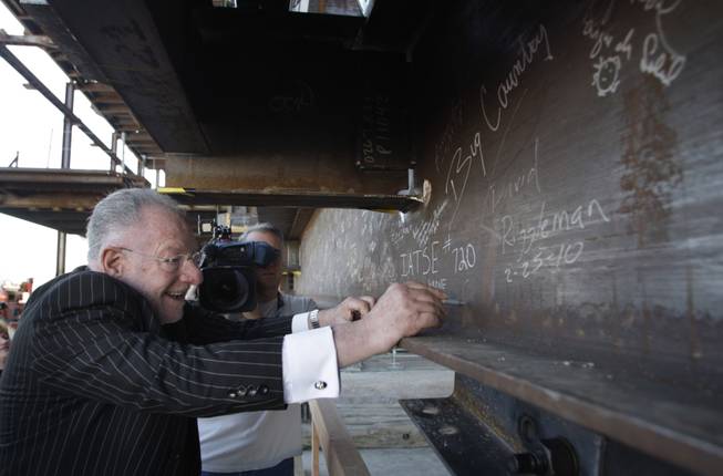 Mayor Oscar Goodman signs a beam during a topping-off ceremony for the Smith Center for the Performing Arts in downtown Las Vegas on Thursday, Feb. 25, 2010.