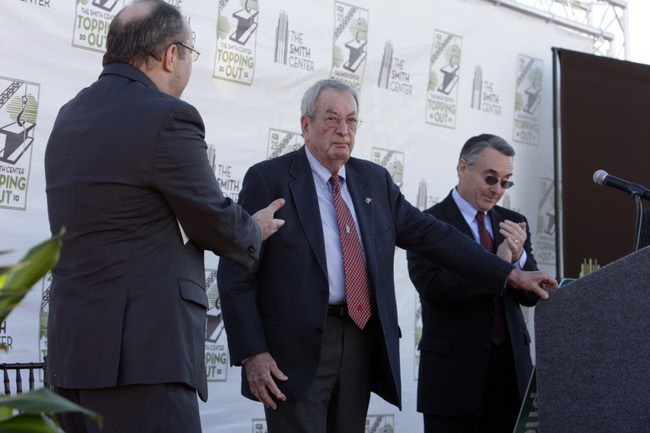 Fred Smith, center, chairman of the Donald W. Reynolds Foundation, receives applause during a topping-off ceremony for the Smith Center for the Performing Arts in downtown Las Vegas Thursday, February 25, 2010. On stage with Smith are Myron Martin, left, Smith Center president and CEO, and Don Snyder, chairman of the Smith Center. The center is named after Fred Smith and his wife Mary.