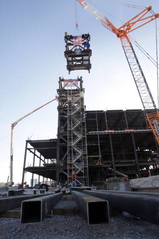 A crane delivers a 50-ton bell tower structure during a topping-off ceremony for the Smith Center for the Performing Arts in downtown Las Vegas Thursday, February 25, 2010.