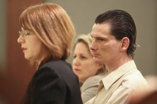 Flanked by his attorneys Stacey Roundtree, left, and Amy Coffee, right, Chester Stiles listens to the testimony of his former girlfriend Tina Allen Thursday afternoon. Stiles faces 22 charges of sexual assault and lewdness, 21 of which can carry a life sentence.