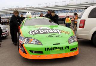 Members of Danica Patrick crew push her car back to the garage during her qualifying run for the Nationwide Series Sam's Town 300 auto race at the Las Vegas Motor Speedway Saturday, February 27, 2010.