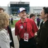 UNLV basketball coach Lon Kruger talks with wife Barb, left, and Cheri Quijano before the start of the Nationwide Series Sam's Town 300 on Saturday.