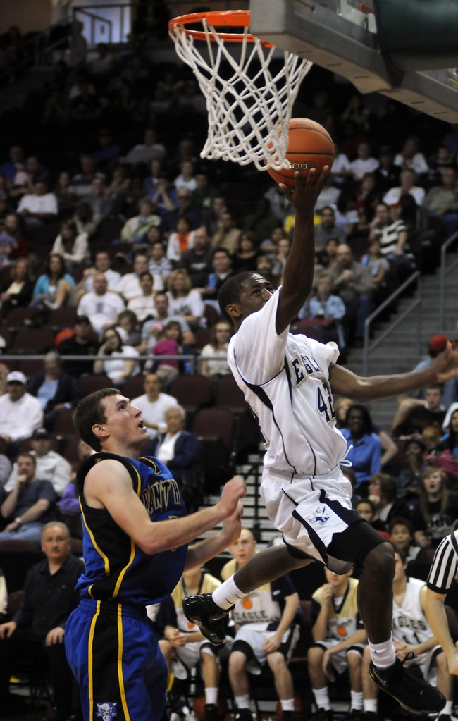 Lake Mead Christian Academy guard De'quan Thompson is shoved by Panther defender Taylor Poulson while scoring a layup during the class 1A state final game at the Orleans Arena on Saturday afternoon.