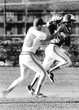 Runnin' Rebels infielder Matt Williams applies a tag to runner. Williams played third base in the major leagues for several years, and won a World Series with the Arizona Diamondbacks. 