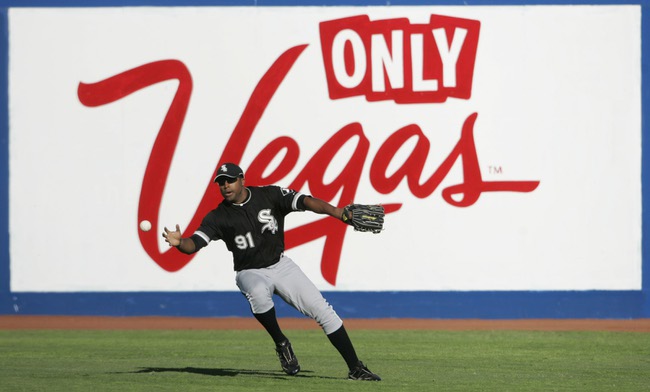 Chicago White Sox right fielder Stefan Gartrell reaches for a shallow fly during an exhibition game against the Chicago Cubs Thursday.