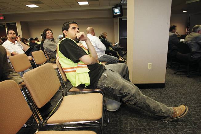 Victor Pulido, a member of Laborers Local 872, listens at the Grant Sawyer building in downtown Las Vegas to testimony during a hearing Friday of the Assembly Commerce and Labor Committee in Carson City and Las Vegas.