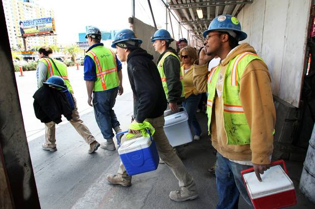 Construction workers leave MGM Mirage's CityCenter after work on Friday. Perini Building Co., the general contractor on CityCenter and Cosmopolitan, in meetings with unions this week sought wage and raise concessions from about 11,000 workers on the sites. Both projects are suffering financial difficulties in the deepening recession.