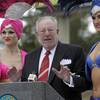 Las Vegas Mayor Oscar Goodman, flanked by showgirls Meda Bell, left, and Candice Dickerson, speaks during a 2010 Earth Hour news conference at the Welcome to Fabulous Las Vegas sign Tuesday, March 9, 2010. Earth Hour will take place on March 27 at 8:30 p.m. Las Vegas time. For the second year in a row, casinos on the Las Vegas Strip will turn off marquee and non-essential exterior lighting for the event.