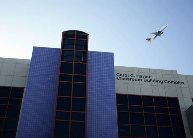 
An airplane flies over the Carol C. Harter Classroom Building Complex at UNLV on Thursday. An uptick in air traffic over the campus has not gone unnoticed by some at the school, but the runway repaving that is to blame is set to end May 1.