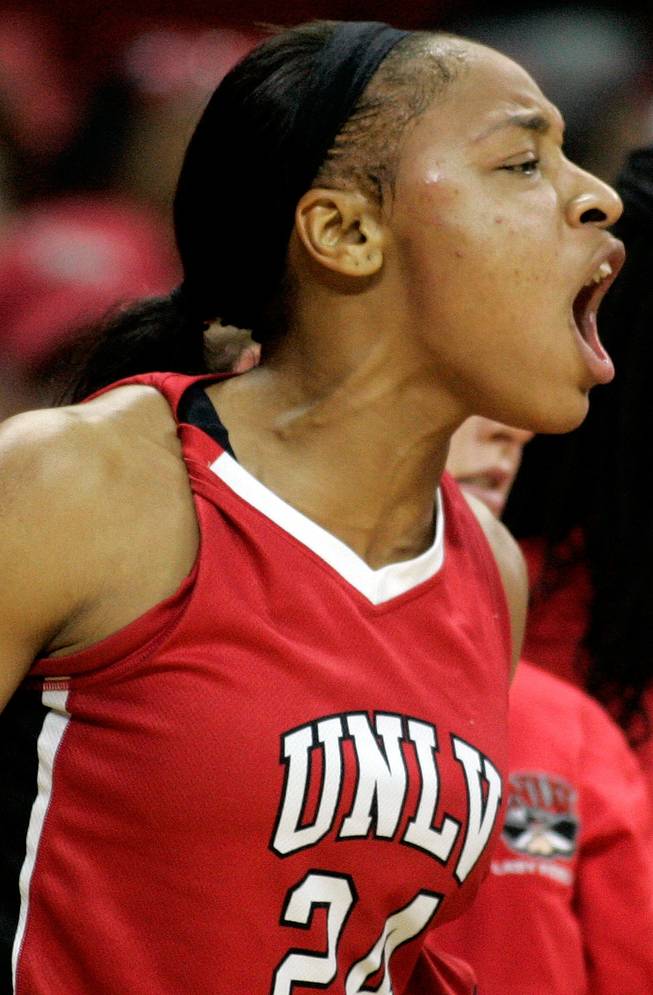 Shamela Hampton of UNLV cheers for her team against BYU during the first round of the Mountain West Championship at the Thomas & Mack Center in Las Vegas on Tuesday. UNLV won the game 66-58. 
