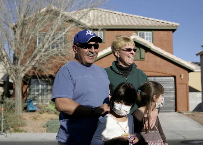 The Cerda family -- Chuck, Terri, Maggie and Molly -- leave their home on Tuesday, which will be torn down and replaced as part of ABC's "Extreme Makeover: Home Edition."