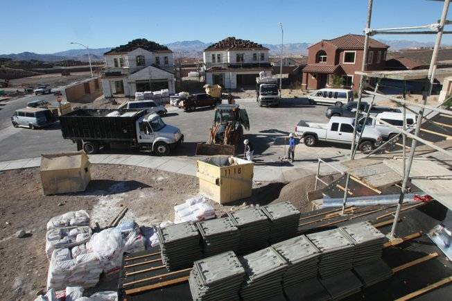 Home building continues in Anthem in Henderson, although the demand for new homes has dropped precipitously. 