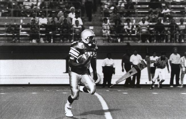 Hunkie Cooper was a two-time all Big West Conference selection while playing for UNLV. Cooper was hired Monday as the new football coach at Canyon Springs High.