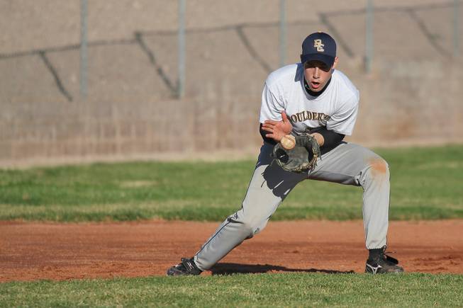 Boulder City third baseman Ross LaMarca makes a catch during infield practice.
