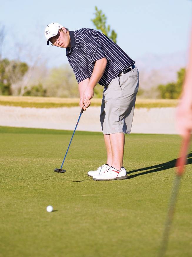 Boulder High School golfer Jeremy Dunbar attempts a putt at the 3rd hole in Boulder City's tournament against Del Sol March 3 at the Wild Horse Golf Club.