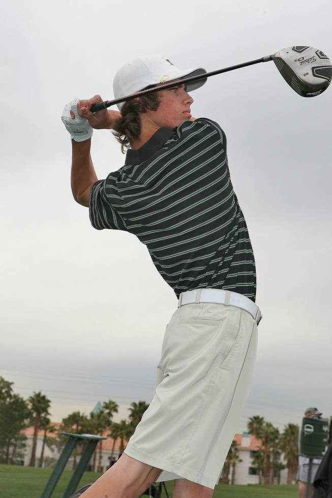 Green Valley junior Ryan Green practices on the driving range at Legacy Golf Club.