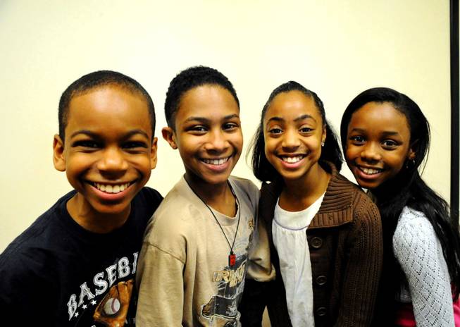Young Simba's Duane Ervin, left,  and Elijah Johnson, center, along with Young Nala's Ruby Crawford, far right, and Jade Nelson, middle. They will perform in the new Las Vegas production of The Lion King, which opens with a preview performance May 5, 2009, at the Mandalay Bay Theatre. The 80-member cast and crew began preparing for the show Monday, March 9, 2009, at the rehearsal hall in a fittingly named place --  the Safari Business Park, 7850 Dean Martin Dr. 