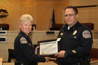 Corrections Officer Jed Robbins receives a Certificate of Appreciation, for coming to the aid of an inmate attempting suicide, Wednesday during the 6th Annual Commendation Award Ceremony.