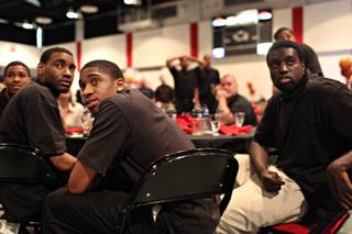 UNLV basketball players watch as NCAA tournament selections are announced Sunday after the 2009 Runnin' Rebel Banquet at Cox Pavilion.
