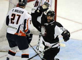 Las Vegas center Chris Ferraro celebrates scoring his 20th goal of the season during the second period against the Ontario Reign at the Orleans Arena on Friday night.