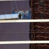 Windows were shattered at the Encore on Thursday after scaffolding struck the resort and two workers were whipped in high winds. 