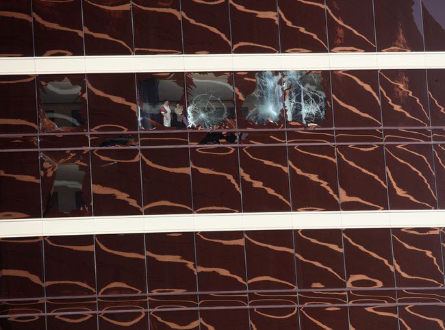 Windows were shattered at the Encore on Thursday after scaffolding struck the resort and two workers were whipped in high winds. 