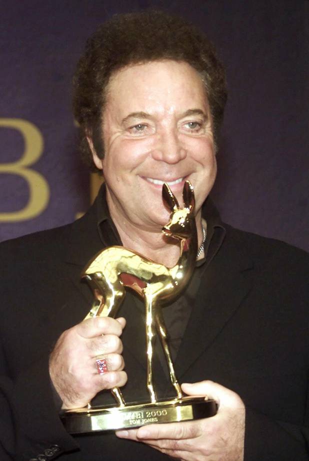 Pop singer Tom Jones smiles as he poses with the ...