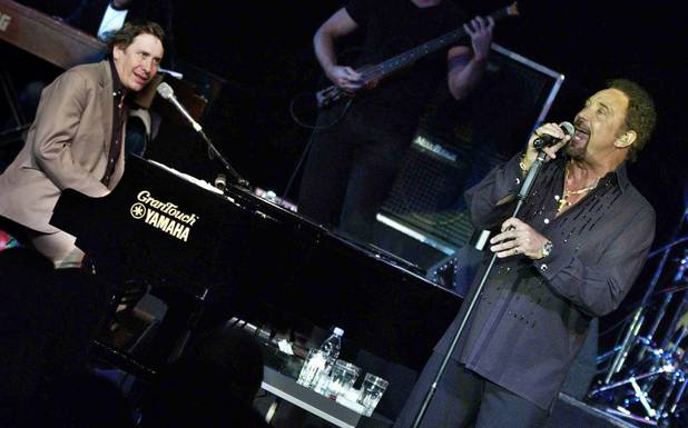 Jools Holland, left, and Tom Jones perform live on stage ...