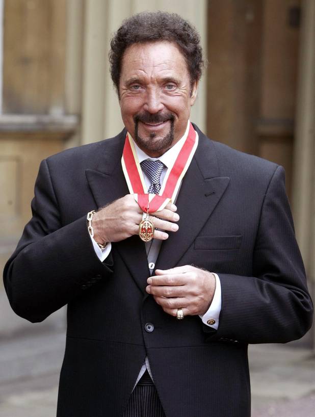 British singing legend Tom Jones displays the knighthood he received ...
