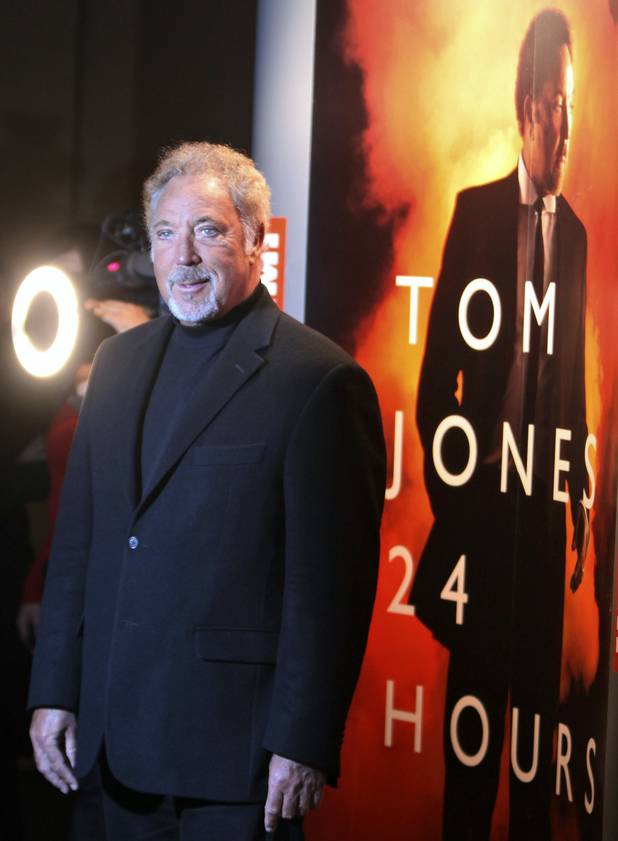Tom Jones talks with journalists during a visit to Warsaw, ...