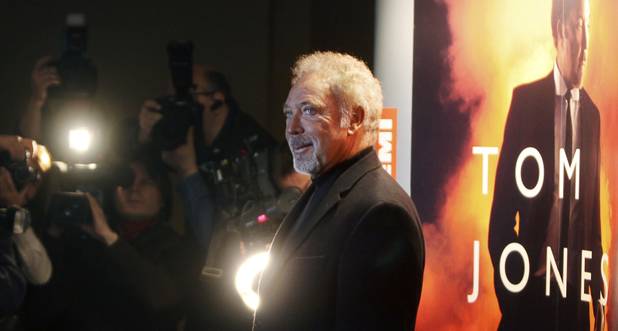 Tom Jones talks with journalists during a visit to Warsaw, ...