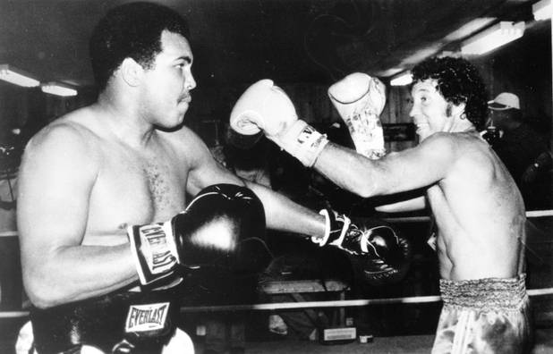 British singer Tom Jones, right, exchanges a few punches with ...