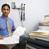 Dr. Navneet Sharda displays a the paperwork he has amassed during a four-year legal fight with another cancer specialist, Dr. Dhan Kaushal. Sharda says claims made by Kaushal about his practice are bogus. "I'm here to get vindicated."