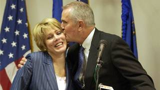 Gov. Jim Gibbons kisses his wife Dawn in August 2003.