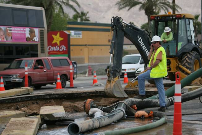 Crews work at the site of a water main break on East Sahara Avenue near Nellis Boulevard.
