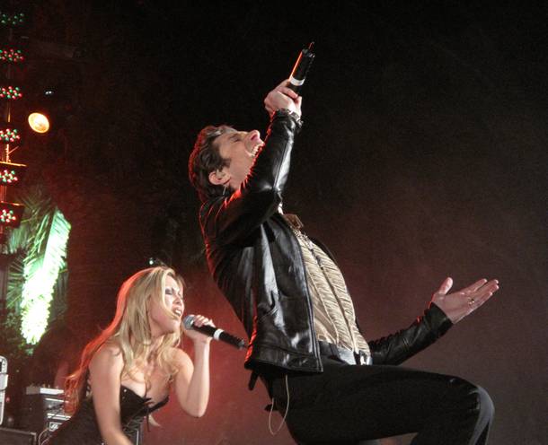 Perry Farrell, right, and his wife, Etty Lau Farrell, left, perform together as Satellite Party at Farrell's 50th birthday party, Perrypalooza.
