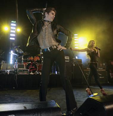 Perry Farrell strikes a pose at his 50th birthday party, Perrypalooza. Meanwhile, his wife, Etty Lau Farrell, struts her stuff in the&nbsp;backfround.
